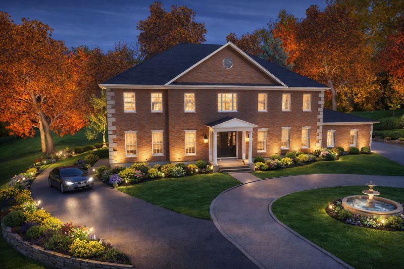 Front elevation of the Fairfax Residence at dusk, with a circular drive and fountain