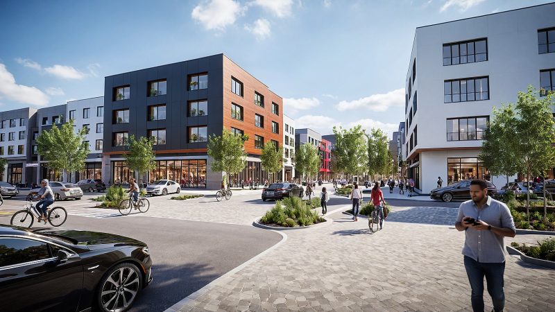 Street-level rendering of the proposed Greenbrier mixed-use center, with ground-floor retail and cyclists